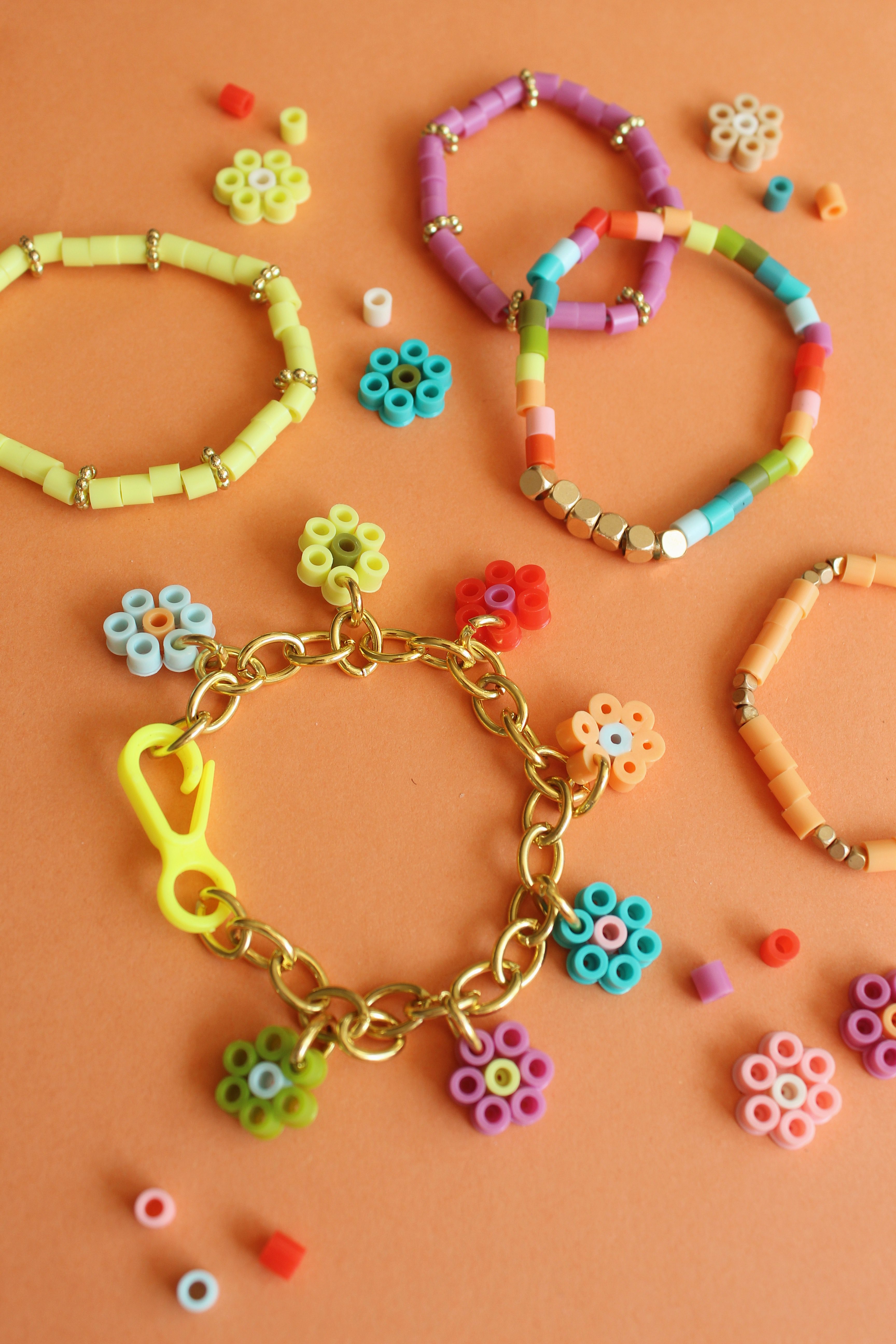 How to Make Flower Charm Perler Bead Bracelets + a tutorial featured by Top US Craft Blog + The Pretty Life Girls
