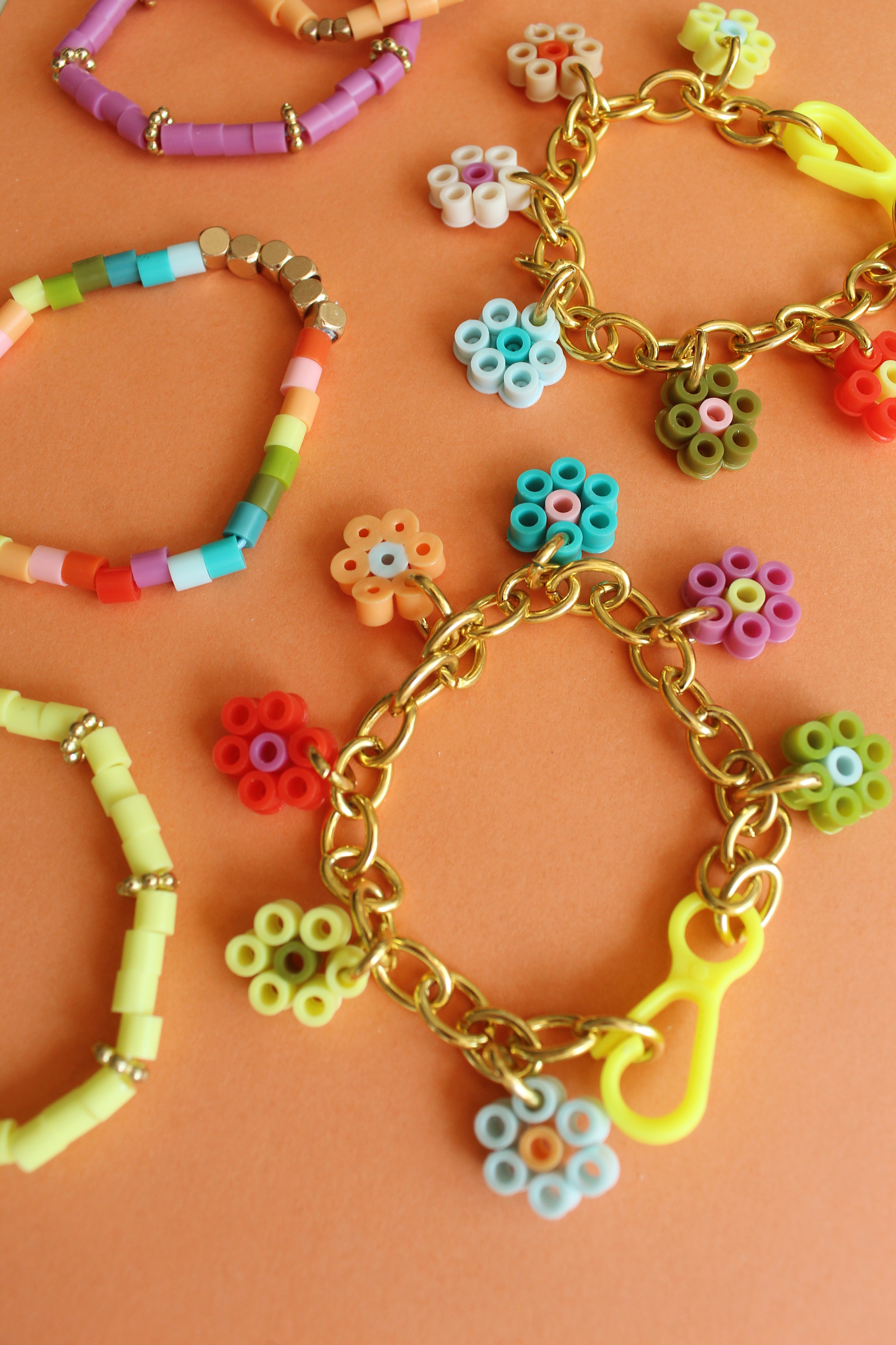 How to Make Flower Charm Perler Bead Bracelets + a tutorial featured by Top US Craft Blog + The Pretty Life Girls