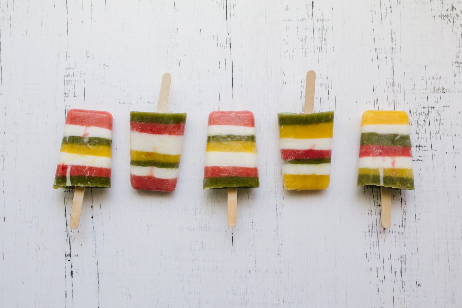 Summer Snacks: Colorful Layered Fruit Juice Popsicles + a tutorial featured by Top US Craft Blog + The Pretty Life Girls